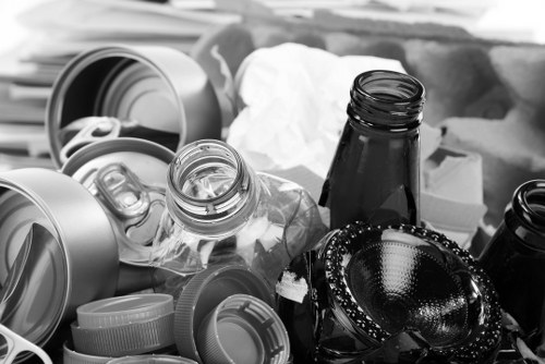 Skip hire safety sign and workers preparing a skip for delivery