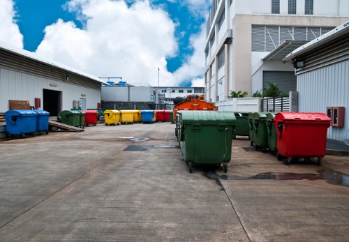 Company vehicle with skip being safely positioned on a street